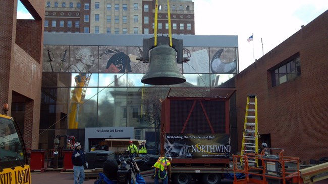 Bicentennial Bell Being Moved out of Former Visitor Center, January 31, 2013 (Credit: National Park Service)